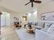 Expansive living room featuring hardwood floors, neutral paint, and large windows at 7890 S Quatar, Aurora, CO 80016