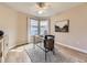 Home office with natural light, modern desk, and a ceiling fan at 7890 S Quatar, Aurora, CO 80016