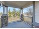 The outdoor porch features gray deck boards and stone pillars at 7890 S Quatar, Aurora, CO 80016