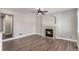 Inviting living room with modern fireplace, neutral tones, and hardwood floors, creating a cozy gathering space at 16117 Ledge Rock Dr, Parker, CO 80134