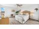 Bright bedroom featuring hardwood floors, a ceiling fan, and comfortable decor at 955 Eudora St # 801E, Denver, CO 80220