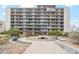 Exterior building with gardens and seating including a fire pit in a park-like setting at 955 Eudora St # 801E, Denver, CO 80220