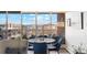 Cozy dining area with scenic views from large windows with seating for four at 955 Eudora St # 801E, Denver, CO 80220