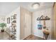 Inviting entryway with decorative shelving, a stylish light fixture, and a patterned rug at 955 Eudora St # 801E, Denver, CO 80220