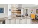 Well-lit kitchen featuring a granite countertop, tile backsplash, and modern appliances at 955 Eudora St # 801E, Denver, CO 80220