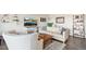 Comfortable living room featuring a plush sofa and an armchair, ideal for relaxation at 955 Eudora St # 801E, Denver, CO 80220