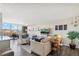 Bright living room with modern furniture, a view, and stylish decor at 955 Eudora St # 801E, Denver, CO 80220