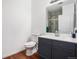 Well-lit bathroom features a modern vanity and a walk-in shower with stylish gray tile at 4085 S Crystal Cir # 104, Aurora, CO 80014