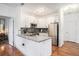 Bright kitchen with granite countertops, modern appliances, and a stylish backsplash at 4085 S Crystal Cir # 104, Aurora, CO 80014