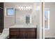 Bathroom featuring a white quartz countertop and a mirror with vanity lights at 4511 Meade St, Denver, CO 80211