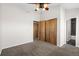 Simple bedroom featuring wood closets and carpet at 4511 Meade St, Denver, CO 80211