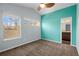 Bright bedroom featuring two windows, a ceiling fan, and a walk-in bathroom with ample space at 4511 Meade St, Denver, CO 80211