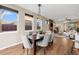 Bright dining area with stylish light fixture, hardwood floors, and natural light at 4511 Meade St, Denver, CO 80211