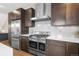 Modern kitchen featuring stainless steel appliances, a large island, and ample cabinet space at 4511 Meade St, Denver, CO 80211