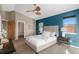 Comfortable main bedroom featuring a walk-in closet, a ceiling fan, and natural light at 4511 Meade St, Denver, CO 80211