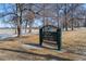 Rocky Mountain Lake Park entrance sign amid leafless trees and winter grass at 4511 Meade St, Denver, CO 80211