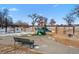 Community playground featuring multiple swing sets and slides for neighborhood  at 4511 Meade St, Denver, CO 80211