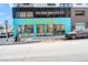 Bright blue building for Call Your Mother with modern architectural design and storefront windows at 4511 Meade St, Denver, CO 80211