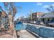 Street lined with trees and various businesses in a vibrant neighborhood at 4511 Meade St, Denver, CO 80211