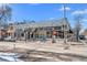 Commercial building with storefronts, awnings, street parking and crosswalk at 4511 Meade St, Denver, CO 80211