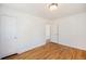 A bright bedroom with beautiful refinished hardwood floors and white trim at 1355 Rosemary St, Denver, CO 80220