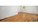 Spacious bedroom with refinished hardwood floors and natural light at 1355 Rosemary St, Denver, CO 80220