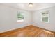 A bright bedroom with beautiful refinished hardwood floors and white trim at 1355 Rosemary St, Denver, CO 80220