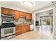 Kitchen with tile floors and stainless steel oven at 1355 Rosemary St, Denver, CO 80220