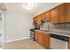 Kitchen with tile floors and stainless steel appliances at 1355 Rosemary St, Denver, CO 80220