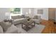 Bright living room featuring hardwood floors, neutral paint, and lots of natural light at 1355 Rosemary St, Denver, CO 80220