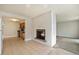Bright living room featuring a fireplace and view of the kitchen at 1355 Rosemary St, Denver, CO 80220