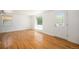 Bright living room with refinished hardwood floors and natural light at 1355 Rosemary St, Denver, CO 80220