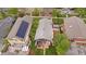 Charming home with a spacious backyard, wood deck, privacy fence, and solar panels on the roof at 3341 Newton St, Denver, CO 80211