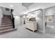 Finished basement featuring stairs, carpet, and a neutral color palette at 3341 Newton St, Denver, CO 80211