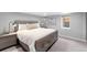 Bedroom with neutral color palette and two end tables at 3341 Newton St, Denver, CO 80211