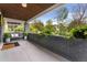 Inviting front porch with a comfortable bench, stylish decor, and a view of the serene surroundings at 3341 Newton St, Denver, CO 80211