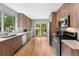 Contemporary kitchen with stainless steel appliances, sleek countertops, and backyard access at 3341 Newton St, Denver, CO 80211
