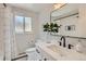 Charming bathroom with sleek fixtures, modern vanity, and a shower with a patterned curtain at 13070 W 15Th Dr, Golden, CO 80401