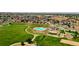 Aerial view showcasing community pool, playground, and expansive green space at 17186 E Cedar Gulch Dr, Parker, CO 80134
