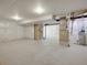 Unfinished basement with concrete flooring, exposed beams and water heater at 17186 E Cedar Gulch Dr, Parker, CO 80134