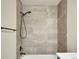 Modern bathroom shower features gray tiled walls and matte black shower fixtures at 17186 E Cedar Gulch Dr, Parker, CO 80134