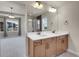 Luxurious bathroom showcasing a double vanity and glass-enclosed shower at 17186 E Cedar Gulch Dr, Parker, CO 80134