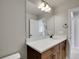 Bathroom featuring a vanity with a white countertop and large frameless mirror at 17186 E Cedar Gulch Dr, Parker, CO 80134
