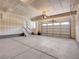 Spacious garage with overhead door, access stairs, and ample parking at 17186 E Cedar Gulch Dr, Parker, CO 80134