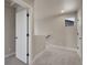 Hallway with carpet and doors to different rooms at 17186 E Cedar Gulch Dr, Parker, CO 80134