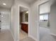 Hallway with carpet and doors to different rooms at 17186 E Cedar Gulch Dr, Parker, CO 80134