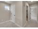 Hallway with carpet and doors to different rooms at 17186 E Cedar Gulch Dr, Parker, CO 80134
