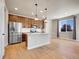 Kitchen with stainless steel appliances, granite countertops, and pendant lighting over the island at 17186 E Cedar Gulch Dr, Parker, CO 80134