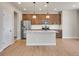 Modern kitchen featuring stainless steel appliances, granite countertops, and pendant lighting at 17186 E Cedar Gulch Dr, Parker, CO 80134