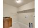 Functional laundry room with ample storage and sink at 17186 E Cedar Gulch Dr, Parker, CO 80134